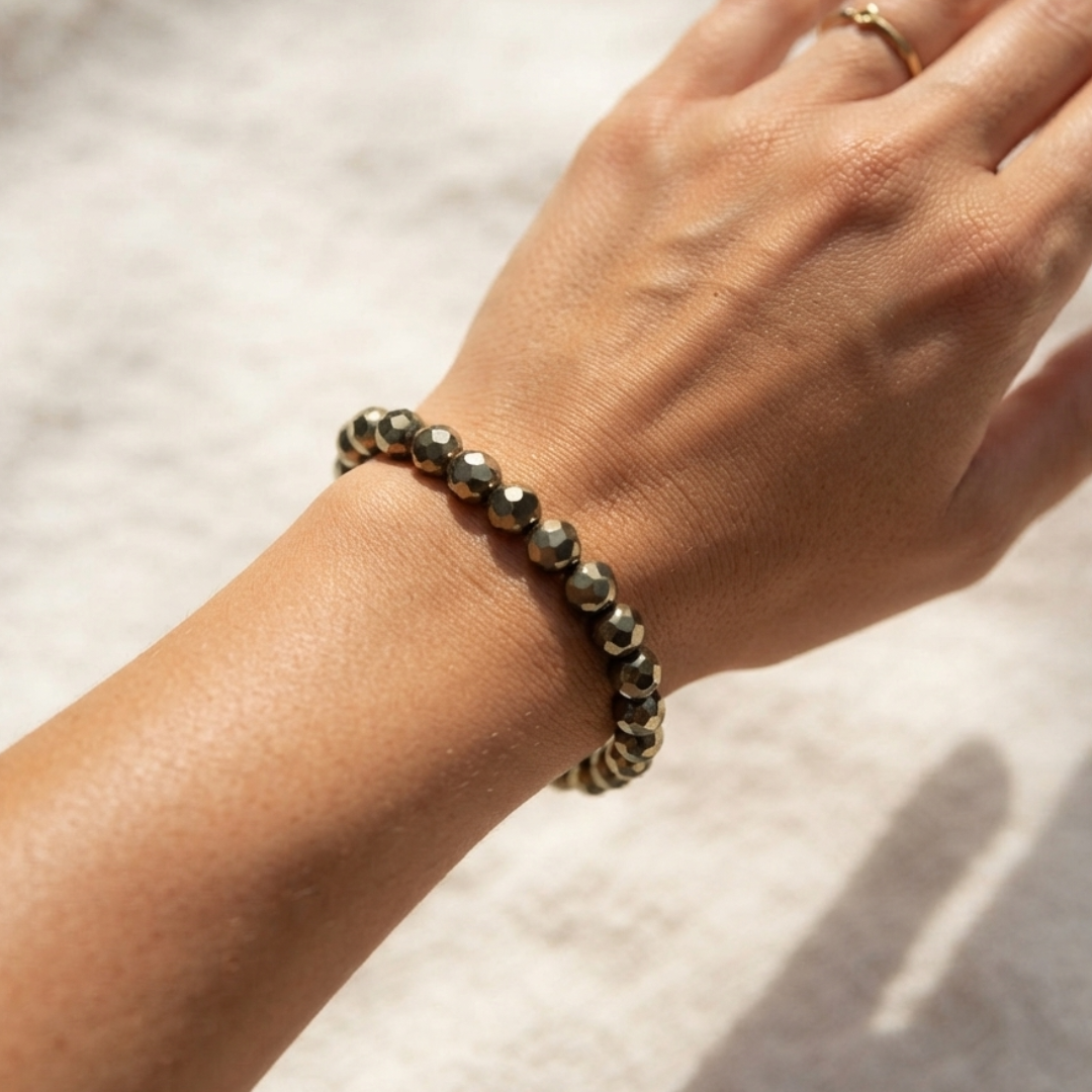 Pyrite Bracelet With Faceted Round Beads Worn On Wrist