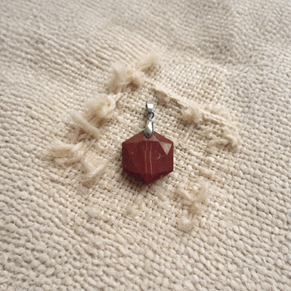 Red Jasper hexagon gemstone pendant worn as a statement necklace