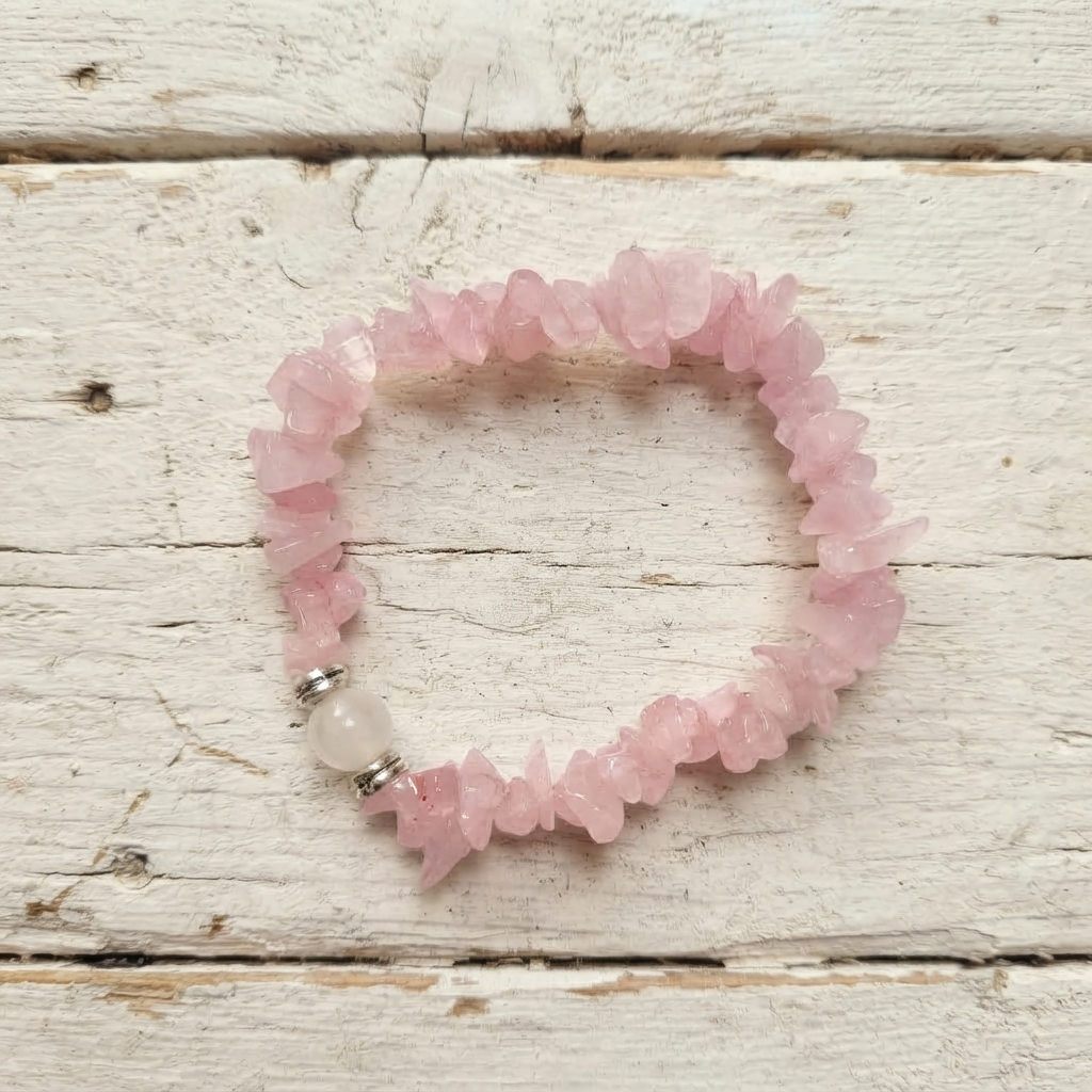 Light Pink Rose Quartz Chip Bead Bracelet On Dark Fabric