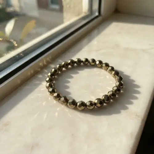 Pyrite Bracelet With Faceted Round Beads Worn On Wrist - 2nd View