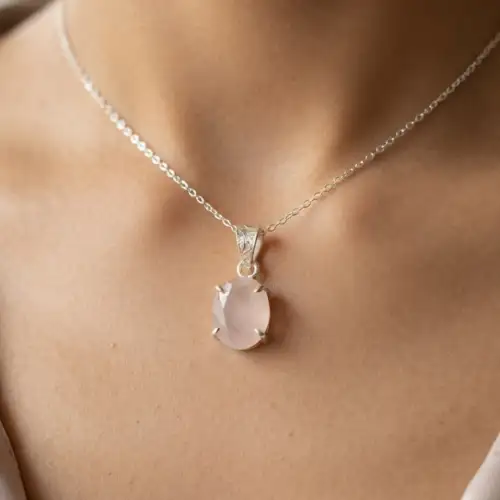 Rose Quartz Pendant Necklace Worn On Neck With Oval Pink Stone